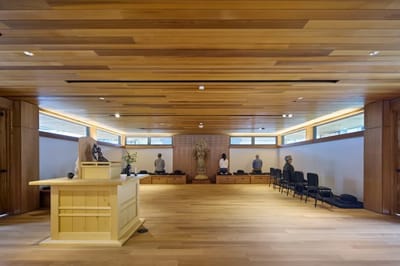 Interior of a serene meditation room with wooden accents