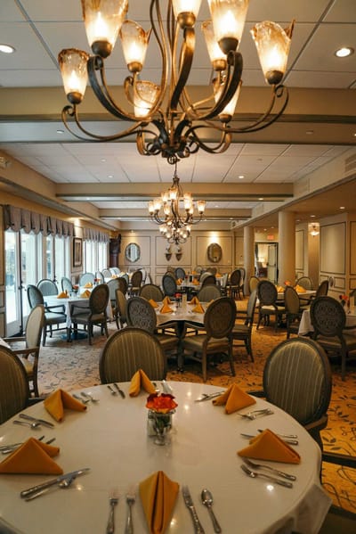 Elegant dining room with tables set for a meal