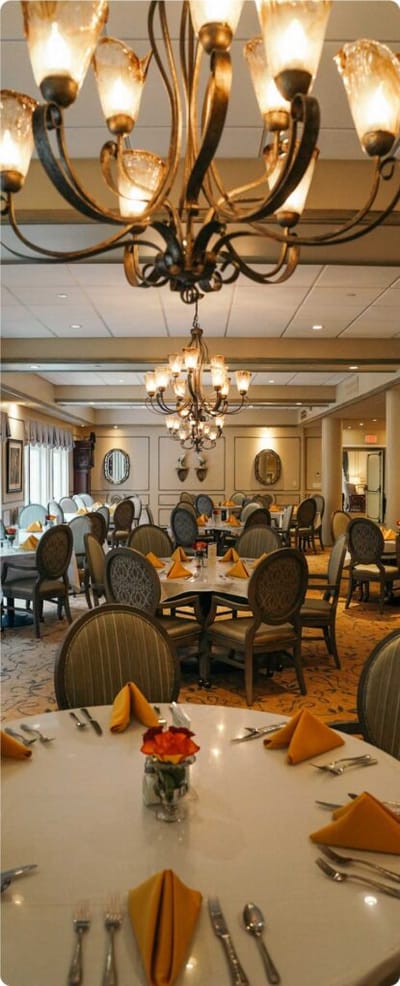 Elegant dining room with tables set for a meal