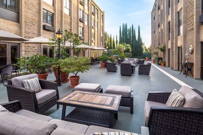 Outdoor courtyard with seating and greenery