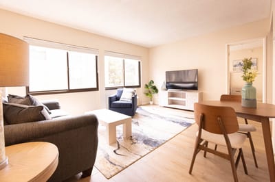Bright and airy common area with furniture