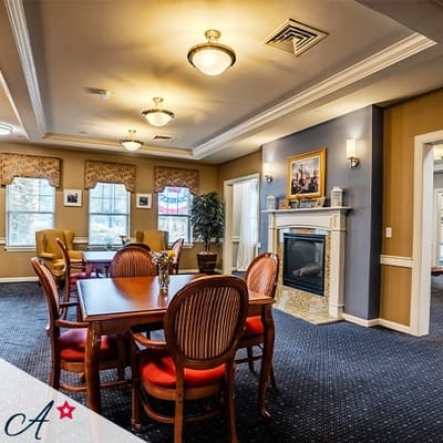 Bright common area with a fireplace and seating