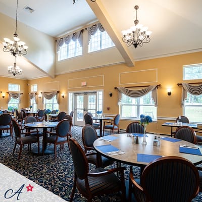Bright dining room with tables set and elegant decor