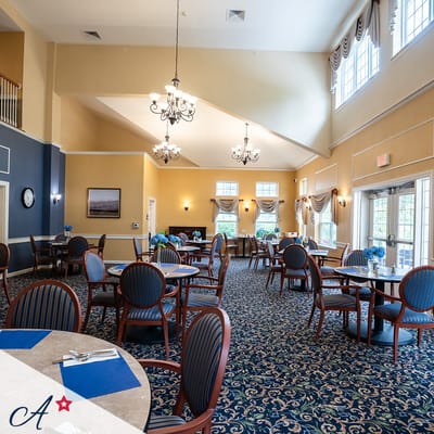Well-furnished dining room with tables and chairs