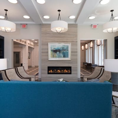 Modern common area with seating and fireplace