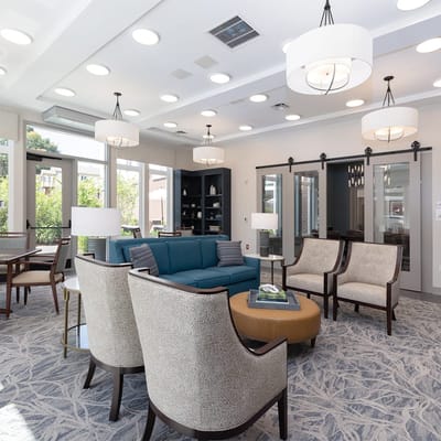 Bright common area with seating and natural light