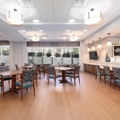 Bright dining area with tables and chairs