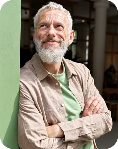 Smiling elderly man in a relaxed indoor setting