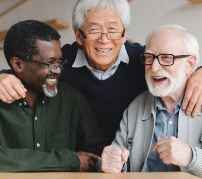 Three residents sharing a joyful moment together