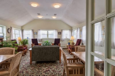 Interior view of a common area with seating and plants