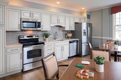 Bright, modern kitchen area with dining table