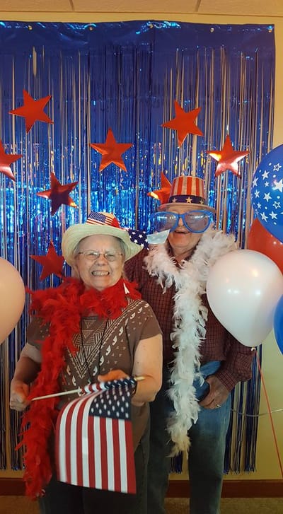 Residents celebrating with decorations and flags