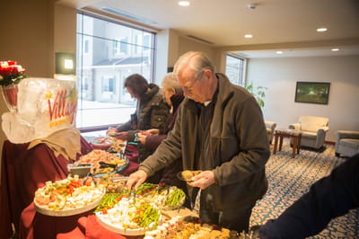 Residents enjoying food at a festive gathering