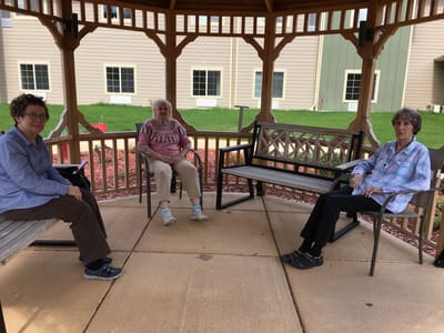 Residents enjoying time in a gazebo