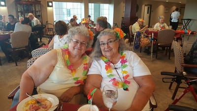 Two residents enjoying a festive meal together