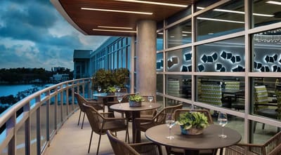 Outdoor dining area with tables and plants