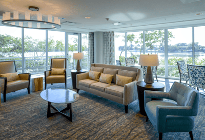 Bright common area with comfortable seating and large windows