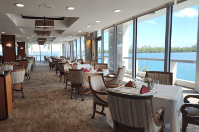 Dining area with tables overlooking the water