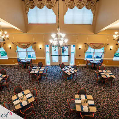 Interior view of a dining room with tables and chairs
