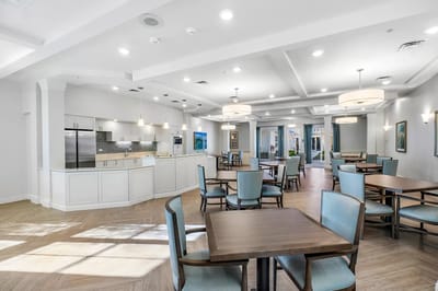 Bright interior common area with tables and chairs