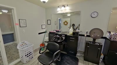 Interior of a salon with styling chair and equipment