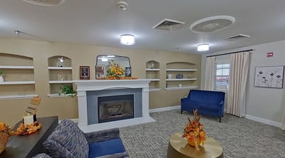 Common area with seating and fireplace