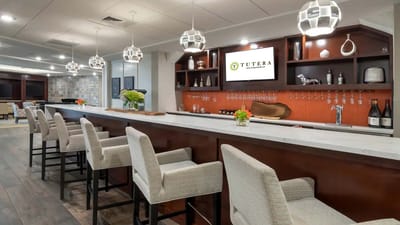 Elegant bar area with seating and decorative lighting