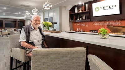 Resident enjoying time in a common area bar