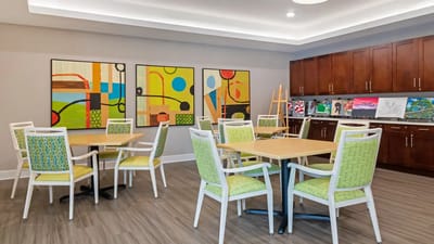 Bright activity room with colorful artwork and seating