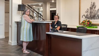 Reception area with staff and resident