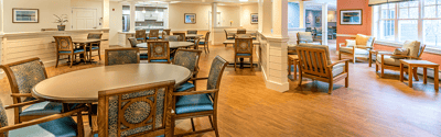 Bright common area with seating and tables