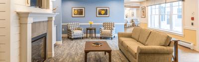 Common area with cozy seating and floral decor