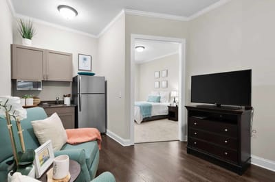Cozy interior of a resident's room with kitchenette