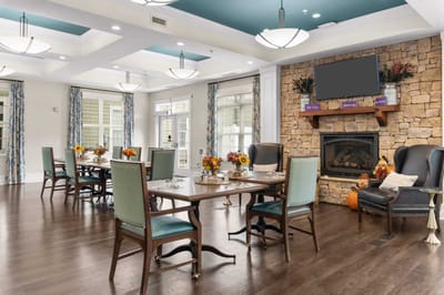 Dining room setup with tables and decorations