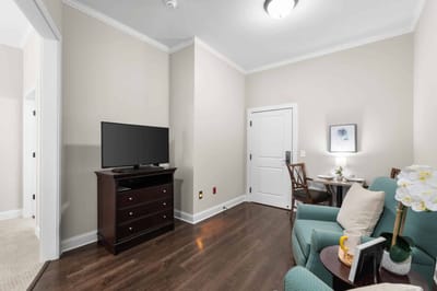 Cozy resident room with a TV and seating area