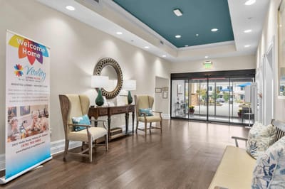 Interior lobby area with seating and welcome banner