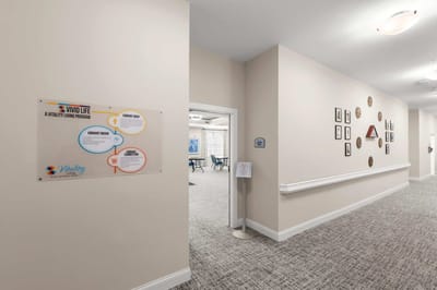 Interior view of a facility hallway with a sign