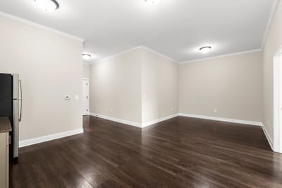 Empty interior room with wood flooring and neutral walls
