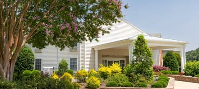 Exterior view of Warwick Forest with landscaped gardens
