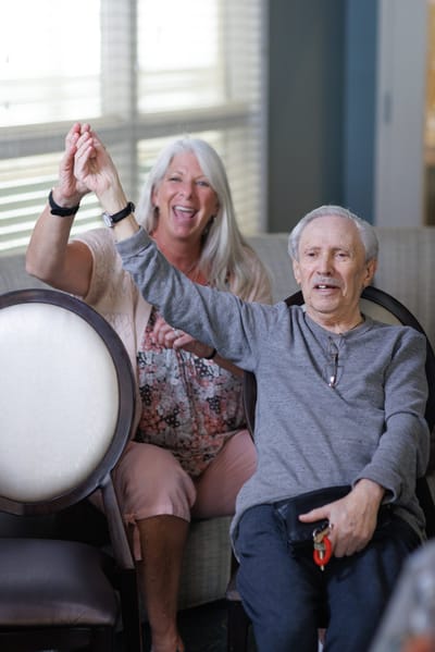 Residents enjoying an activity together in the common area