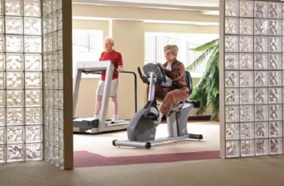 Residents exercising in a fitness area