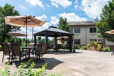 Outdoor seating area with pergola and umbrellas