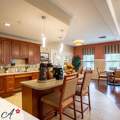 Warm dining area with coffee station and seating