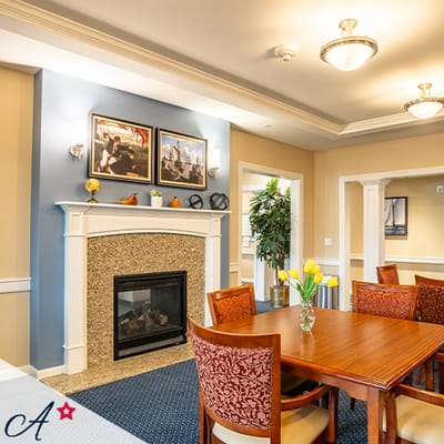 Common area with a dining table and fireplace