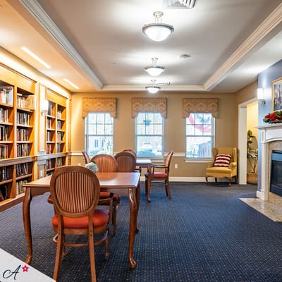 Cozy common area with bookshelves and seating