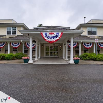Front entrance of community decorated with banners