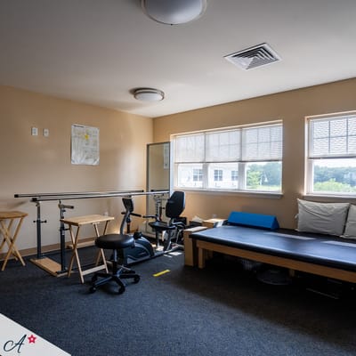 Rehabilitation room with equipment and therapy setup
