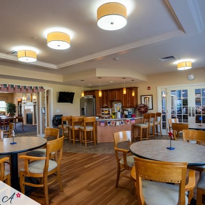 Dining area with tables and a bistro in the background