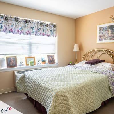 Cozy bedroom with floral decor and personal photos