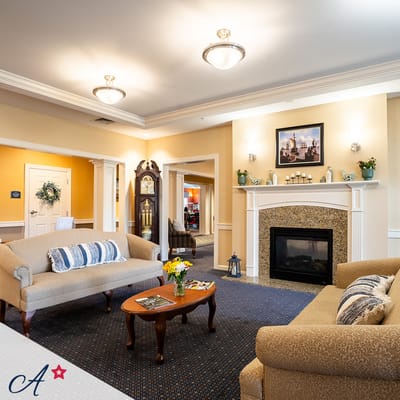 Common area with comfortable seating and a fireplace